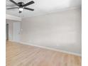 Bright, neutral living room with light-colored walls and hardwood flooring at 10116 Straphinge Trl, Covington, GA 30014