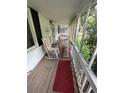 Relaxing screened porch featuring rocking chairs and rugs, perfect for enjoying the outdoors at 167 Mathews Se Cir, Marietta, GA 30067