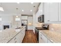 Kitchen with granite countertops, stainless steel appliances, and plenty of cabinet space at 3182 Hartford Mill Pl, Duluth, GA 30097