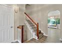 Inviting foyer with hardwood floors, staircase, and access to the living areas, creating a welcoming entrance to the home at 804 Rose Creek Walk, Woodstock, GA 30189