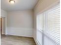 Bright and airy living room with hardwood floors, crown molding, and a large window for ample natural light at 4912 Lightwood Nw Ct, Acworth, GA 30102