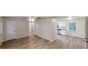 Open living space showcasing new floors, crisp white walls, and access to the kitchen at 7125 Puckett Sw St, Covington, GA 30014