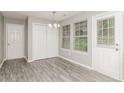 Bright dining area with natural light, featuring a chandelier and a closet at 5229 Kirk Dr, Atlanta, GA 30349
