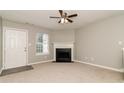 Cozy living room features a fireplace and neutral tones, creating an inviting atmosphere at 5229 Kirk Dr, Atlanta, GA 30349