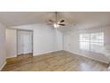 Spacious living room with vaulted ceiling, ceiling fan, and lots of natural light at 6614 Biscayne Blvd, Rex, GA 30273