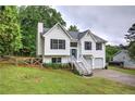 Charming two-story home with a well-manicured lawn and two-car garage at 70 Ashbury Ct, Dallas, GA 30157