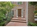 Inviting brick home entrance featuring an ornate front door and brick steps at 1243 Williamswood Pointe, Decatur, GA 30033