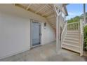 Exterior staircase leading to front door of condo unit with door number 203 at 203 Bridge Se Ln, Smyrna, GA 30082
