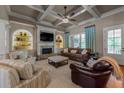Cozy living room featuring a fireplace, built-in shelving and coffered ceilings at 341 Carl Sanders Dr, Acworth, GA 30101