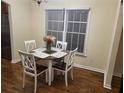 Cozy dining area with hardwood floors and natural light from the window at 737 Cooper Sw St, Atlanta, GA 30315