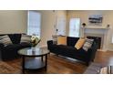 Comfortable living room featuring hardwood floors, neutral paint, and modern decor at 737 Cooper Sw St, Atlanta, GA 30315