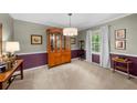 Dining room with decorative molding and classic furniture at 1541 Eldonlas Ct, Stone Mountain, GA 30087