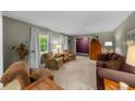 Cozy living room with plush seating and natural light at 1541 Eldonlas Ct, Stone Mountain, GA 30087