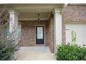 Charming front entrance with brick facade, covered porch, and a welcoming front door at 2289 Overlook Ave, Lithonia, GA 30058
