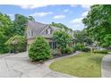 A beautiful exterior elevation with an expansive lawn and driveway at 4842 Registry Nw Dr, Kennesaw, GA 30152