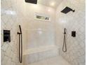 Walk-in shower with dual shower heads and elegant marble tile at 5360 Northwater Way, Duluth, GA 30097