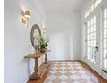 Bright entryway featuring hardwood floors, stylish decor, and a charming rug at 95 Whitlock Sw Ave, Marietta, GA 30064