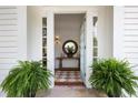 Open entryway with hardwood floors, and a stylish mirror and console table at 95 Whitlock Sw Ave, Marietta, GA 30064