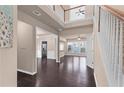 Elegant foyer with hardwood floors and staircase leading to the upper level at 1212 Lake Point Way, Suwanee, GA 30024