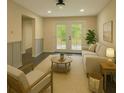 Bright living room with light colored decor and French doors leading to an outdoor deck at 2851 Headland Dr, East Point, GA 30344