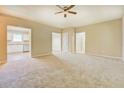 Spacious living room featuring neutral walls, carpet flooring, and a view of the adjacent kitchen at 126 Usher Ln, Covington, GA 30016