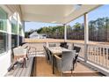 Inviting porch with outdoor dining area and views of the backyard at 1721 Mcgarity Rd, Temple, GA 30179