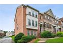 Brick townhome with beautiful landscaping and steps leading to front entrance at 2149 Shoop Se Ct # 3, Smyrna, GA 30080