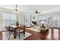 Bright living and dining area featuring hardwood floors, fireplace, and ample natural light at 2149 Shoop Se Ct # 3, Smyrna, GA 30080