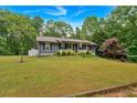 Lovely one-story home with a spacious front yard, perfect for outdoor activities and curb appeal at 305 Devilla Trce, Fayetteville, GA 30214