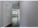Inviting entryway with hardwood floors, neutral paint, and an open view to the living area at 1632 Lenox Overlook Ne Rd, Brookhaven, GA 30329