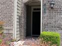 Close-up of front door and address number in brick facade with manicured landscaping at 1632 Lenox Overlook Ne Rd, Brookhaven, GA 30329