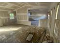 Open living room design with hardwood floors and lots of potential for renovation at 4865 Surrey Dr, Roswell, GA 30075