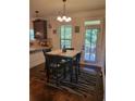 Eat-in kitchen breakfast nook with a four-seater table near a door with a view of the outside at 65 Waters Edge Ln, Covington, GA 30014