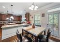 Eat-in kitchen featuring granite countertops, stainless steel appliances and natural lighting at 65 Waters Edge Ln, Covington, GA 30014