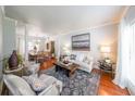 Bright and airy living room with hardwood floors, elegant furniture, and large windows at 111 Springshade Ln, Canton, GA 30114