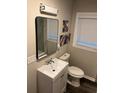 Modern bathroom featuring new vanity, sleek mirror, and fixtures at 2148 Meador Se Ave, Atlanta, GA 30315