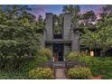 Attractive exterior of home featuring mature landscaping and a private entrance at 318 Tuxworth Cir, Decatur, GA 30033