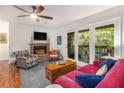 Bright living room with hardwood floors, fireplace, and glass doors to deck at 318 Tuxworth Cir, Decatur, GA 30033