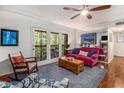 Bright living room with hardwood floors, sliding glass doors to deck, and comfortable furniture at 318 Tuxworth Cir, Decatur, GA 30033