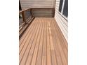 View of the wood patio deck with wood and iron railings at 4540 Cold Spring Ct, Cumming, GA 30041