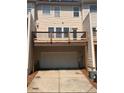 Rear exterior view of the home, showing the wood patio deck and garage at 4540 Cold Spring Ct, Cumming, GA 30041