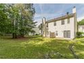 A serene backyard with mature trees, offering ample space and privacy for outdoor enjoyment at 5680 Hampton Ct, Atlanta, GA 30349