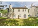 Exterior view of a two-story home with a spacious backyard and patio area at 5680 Hampton Ct, Atlanta, GA 30349