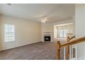 Inviting living room with a fireplace, large windows, and a neutral color palette at 5680 Hampton Ct, Atlanta, GA 30349
