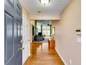 Inviting foyer with hardwood floors, neutral walls, and a view into the spacious living area at 2721 Maeve Ct, Dacula, GA 30019