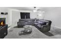 Spacious living room offering a fireplace, ceiling fan, and comfortable seating arrangement at 1105 Mitchell Crossing Sw Dr, Atlanta, GA 30331