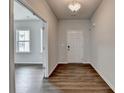 Bright entryway featuring hardwood floors and an open view into the adjacent living area, great for hosting at 1603 Maston Rd, Auburn, GA 30011