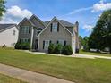 Beautiful 2-story home with manicured lawn and dark shutters, offering classic suburban charm at 4279 Persian Ct, Snellville, GA 30039