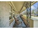 Inviting front porch with rocking chairs and decorative ironwork creating a cozy outdoor space at 1436 Diamond Head Drive Dr, Decatur, GA 30033