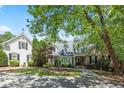 Charming home with a lush landscaped front yard and stone walkway at 240 Rose Ridge Dr, Canton, GA 30115